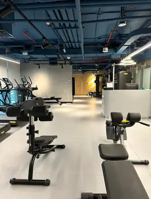 a gym with a lot of chairs in a room at Palm Jumeirah 1BR - Rooftop Infinity Pool in Dubai