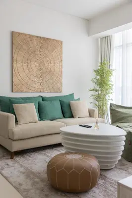a living room with a couch and a coffee table at Palm Jumeirah 1BR - Rooftop Infinity Pool in Dubai