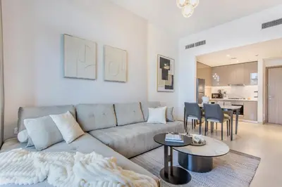 a living room with a couch and a table at Fantastic1BR Furnished Apt at Azizi Park Avenue! in Dubai