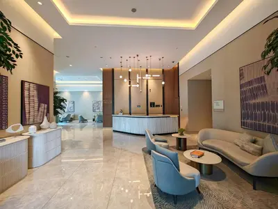a lobby of a hotel with couches and chairs at Brand New 1BR Downtown - Next to Dubai Mall in Dubai