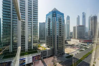 an aerial view of a city with tall buildings at Stylish studio with storage room in hotel l Fits 2 in Dubai