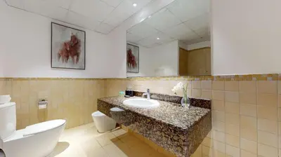 a bathroom with a sink and a toilet at Vacationer I Premium 3 Bedroom Apartment I Steps Away from JBR Beach in Dubai
