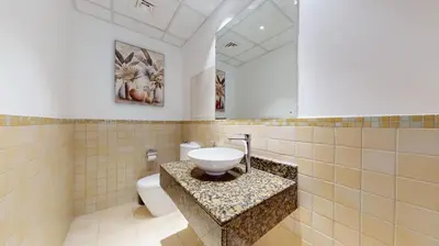 a bathroom with a sink and a toilet at Vacationer I Premium 3 Bedroom Apartment I Steps Away from JBR Beach in Dubai
