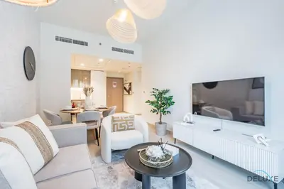 a living room with a couch and a table at Stunning 1BR Apartment in Azizi Riviera 42, Al Merkadh by Deluxe Holiday Homes in Dubai