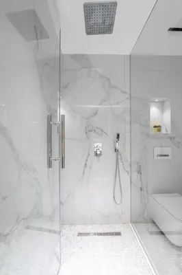 a bathroom with a shower with a glass door at Seaside Elegance - NEW Luxury 3-Bedroom Apt in JBR in Dubai