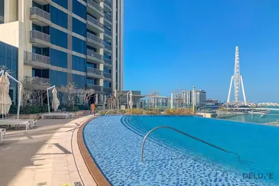 a large swimming pool in front of a building at Alluring 1BR with Marina View at 5242 Tower 2 Dubai Marina by Deluxe Holiday Homes in Dubai