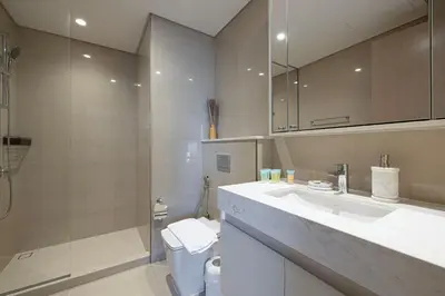 a bathroom with a sink and a toilet and a shower at Incredible Burj Khalifa Views, Next to Dubai Mall in Dubai