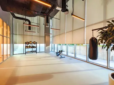 a large room with large windows in a building at the London Condo - Forte Downtown Dubai in Dubai