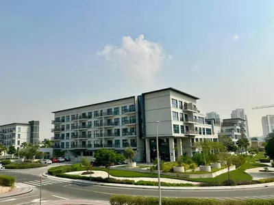 a large building with a street in front of it at Cozy Studio with sun terrace in Dubai
