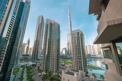 a view of a city skyline with tall buildings at Your 2BR with Burj Khalifa View in Dubai