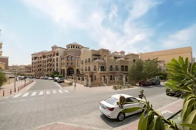 a car parked in front of a large building at 1-Bed in Binghatti Crescent, Next to Circle Mall in Dubai