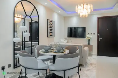 a dining room with a table and chairs at Clever Guest 025 Dubai Gate 1 in Dubai