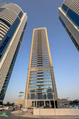 two tall buildings with a blue sky in the background at Clever Guest 025 Dubai Gate 1 in Dubai