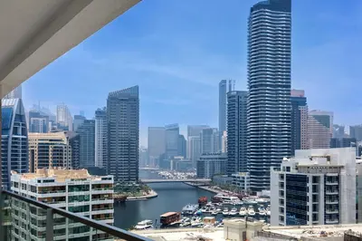 a view of a city with a river and buildings at Cozy 2 bedroom apartment in Dubai Marina in Dubai