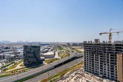 an aerial view of a city with a crane at GuestReady - Sky-High Comfort at Dubai Hills in Dubai