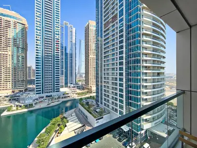 a view of a city with tall buildings and water at StoneTree - Stunning Lake View - Spacious in Dubai