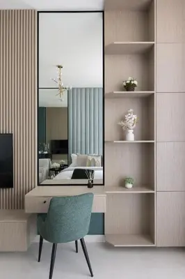 a bedroom with a mirror and a chair and a bed at Cozy Studio in Westwood By IMTIAZ in Dubai