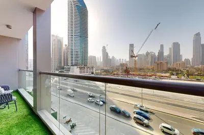 a balcony with a view of a city at The Sterling - Modern One Bedroom in Dubai