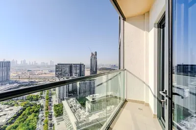 an apartment balcony with a view of a city at Sobha waves I Cozy 1BDR I Burj Khalifa View in Dubai