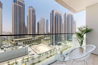 a balcony with a view of a city skyline at Palace Residences - Inviting One Bedroom in Dubai