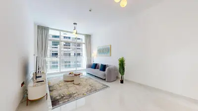 a white living room with a couch and a window at Locations I Uni Estate Supreme Residence I Luxury 1BR I Near Miracle Garden I Pool, Gym & Parking in Dubai