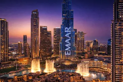 a nighttime view of a city with a fountain at Elite Royal Apartment - Sky Series - Full Burj Khalifa & Fountain View - Noble in Dubai