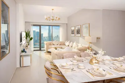 a living room with a table and a couch at Elite Royal Apartment - Sky Series - Full Burj Khalifa & Fountain View - Noble in Dubai
