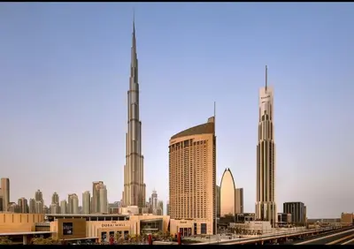 a view of a city skyline with two tall buildings at Emaar Residence Fashion Avenue in Dubai