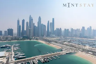 an aerial view of a city with a marina at Marina Vista 2, Emaar Beachfront - Mint Stay in Dubai
