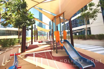 a playground with a slide in a building at LUX The Executive Burj Khalifa View Suite in Dubai