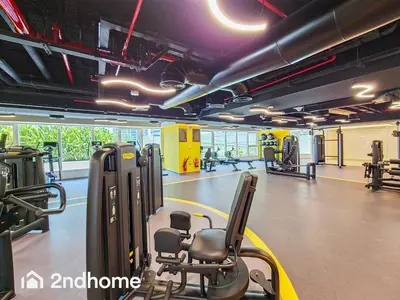 a gym with treadmills and machines in a gym at 2ndHome - Me Do Re , Cluster L, JLT in Dubai