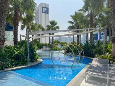 a pool at the miami marriott hotel at Manzil - 1BR Apartment in Paramount with Top-Floor Luxury Living in Dubai