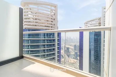 a balcony with a view of a city at Manzil - 1BR Apt with Pool close to Downtown in Dubai