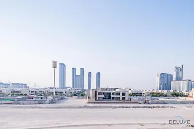 a view of a city skyline with tall buildings at Delightful Studio Apartment in Azizi Riviera 20, Al Merkadh by Deluxe Holiday Homes in Dubai