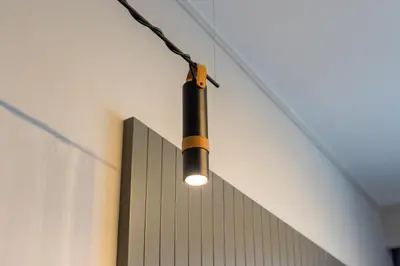 a light hanging from the side of a wall at Vacay Lettings - MAG -318 in Dubai