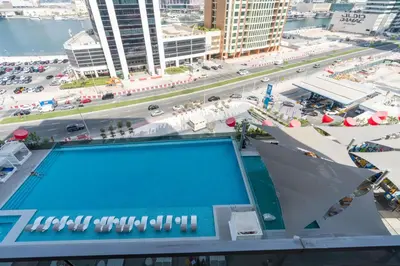 an overhead view of a swimming pool on top of a building at Vacay Lettings - MAG -318 in Dubai
