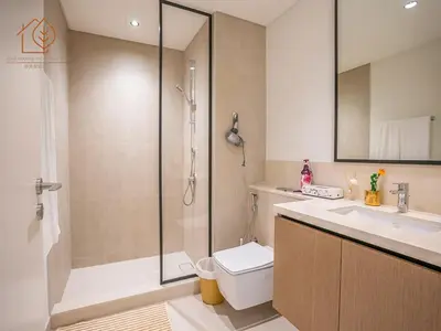 a bathroom with a shower and a toilet and a sink at Top Floor Home with Amazing City Views 188BC-2 in Dubai