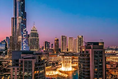 a view of a city skyline at night at Elite Royal Apartment - Full Burj Khalifa & Fountain View - Luxury Edition - Strategos in Dubai