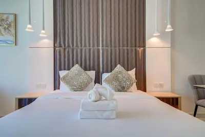 a bedroom with a bed with towels on it at Business Bay Studio in hotel l Sleek & Modern for 2 in Dubai
