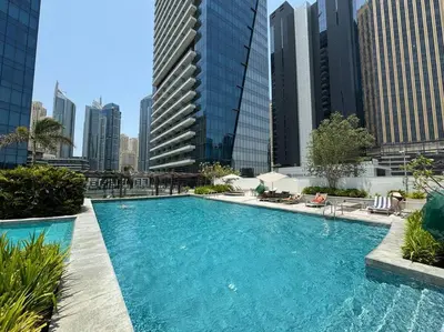 a swimming pool in a city with tall buildings at Stylish Studio with Premium Features in Marina in Dubai
