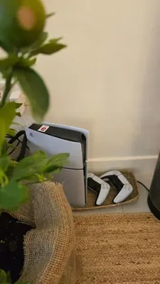 a pair of shoes are next to a printer at Luxury 2BR Biophilic Retreat with Private Jacuzzi, Massage Chair & Infinity Pool in Dubai