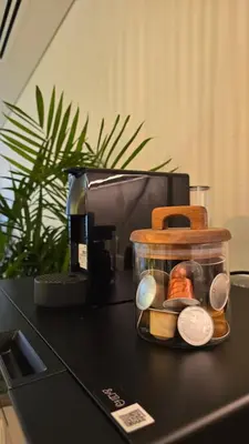 a container of money sitting on top of a counter at Luxury 2BR Biophilic Retreat with Private Jacuzzi, Massage Chair & Infinity Pool in Dubai