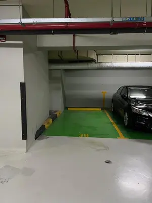 a parking garage with a car parked in it at What a view - very close to DMCC metro station in Dubai