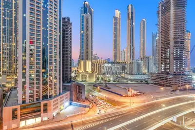a city skyline with tall buildings and a freeway at FIRST CLASS Studio Stylish Haven in Dubai