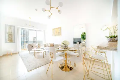 a white living room with a table and chairs at Marina Tower - Stunning 1BHK with Marina View by Elegant Escape's in Dubai