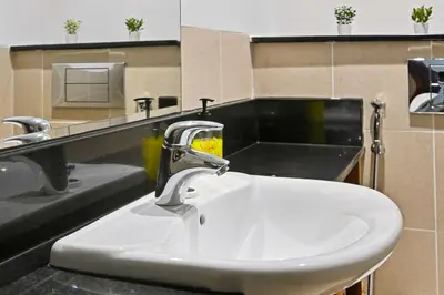 a bathroom sink with a faucet on a counter at Incredible downtown location in Dubai