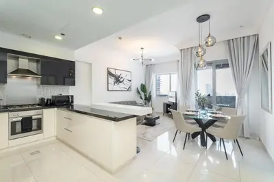 a kitchen and dining room with a table and chairs at New Listing & Burj Khalifa View & Dubai Mall in Dubai
