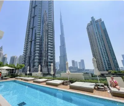 a hotel swimming pool with a view of the city at Apartment in Downtown Dubai in ACT I ACT II - 5 min walk to Dubai Mall in Dubai