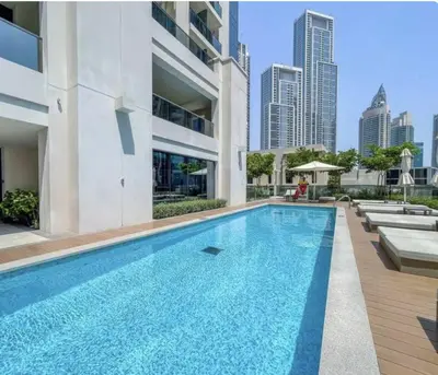 a swimming pool in the middle of a building at Apartment in Downtown Dubai in ACT I ACT II - 5 min walk to Dubai Mall in Dubai