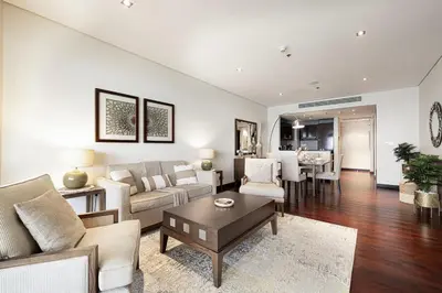 a living room with a couch and a table at Beachfront Residences with Full Sea and Burj AlArab Views in Luxury Resort in Dubai